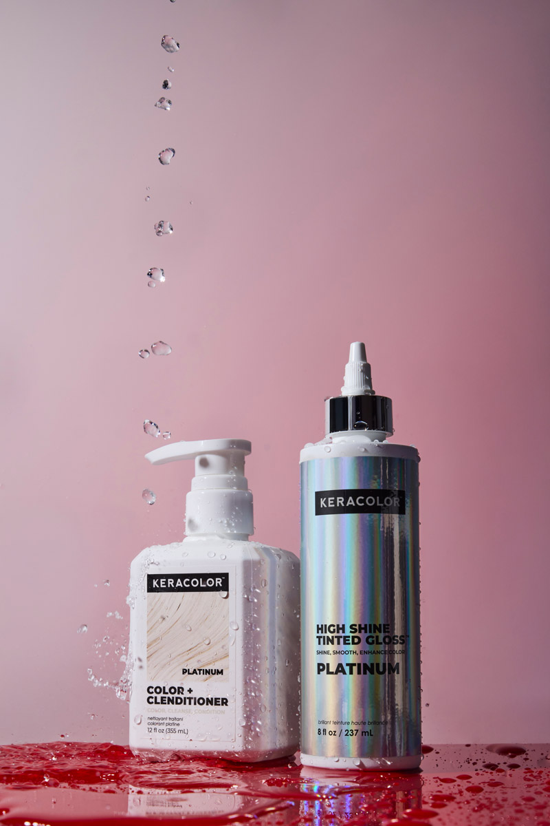 Keracolor Color + Clenditioner and High Shine Tinted Gloss in Platinum, splashed with water against a pink background