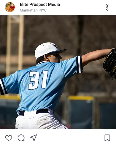 Baseball player wearing number 31 in light blue jersey pitching a ball during a game.