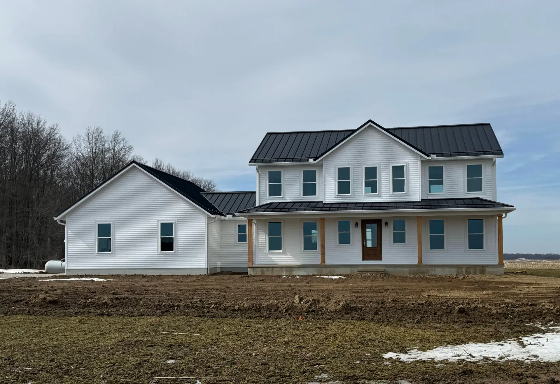 white siding two story house with attached garage