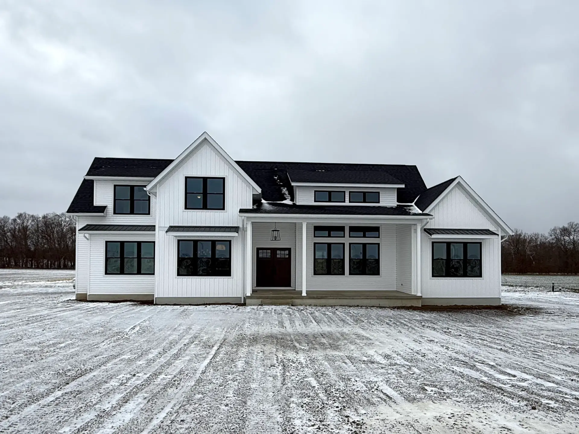 white siding two story home in winter