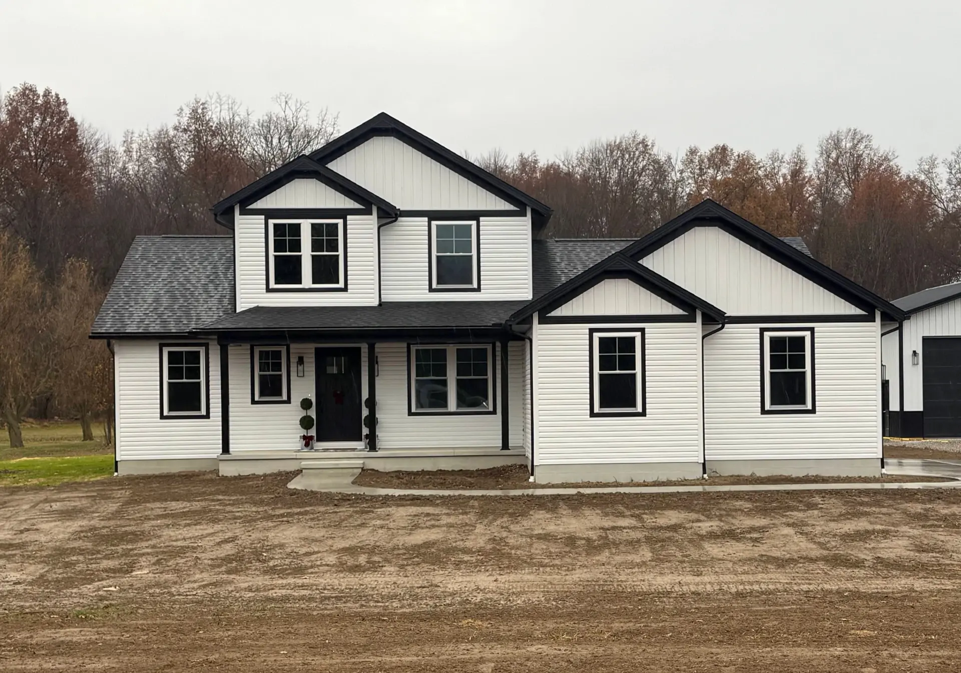 white siding two story home with front porch