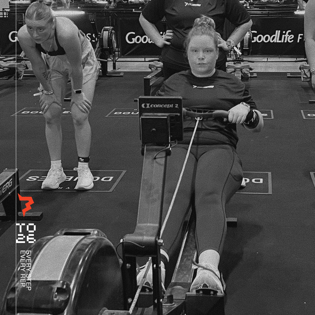 woman rowing at HYROX