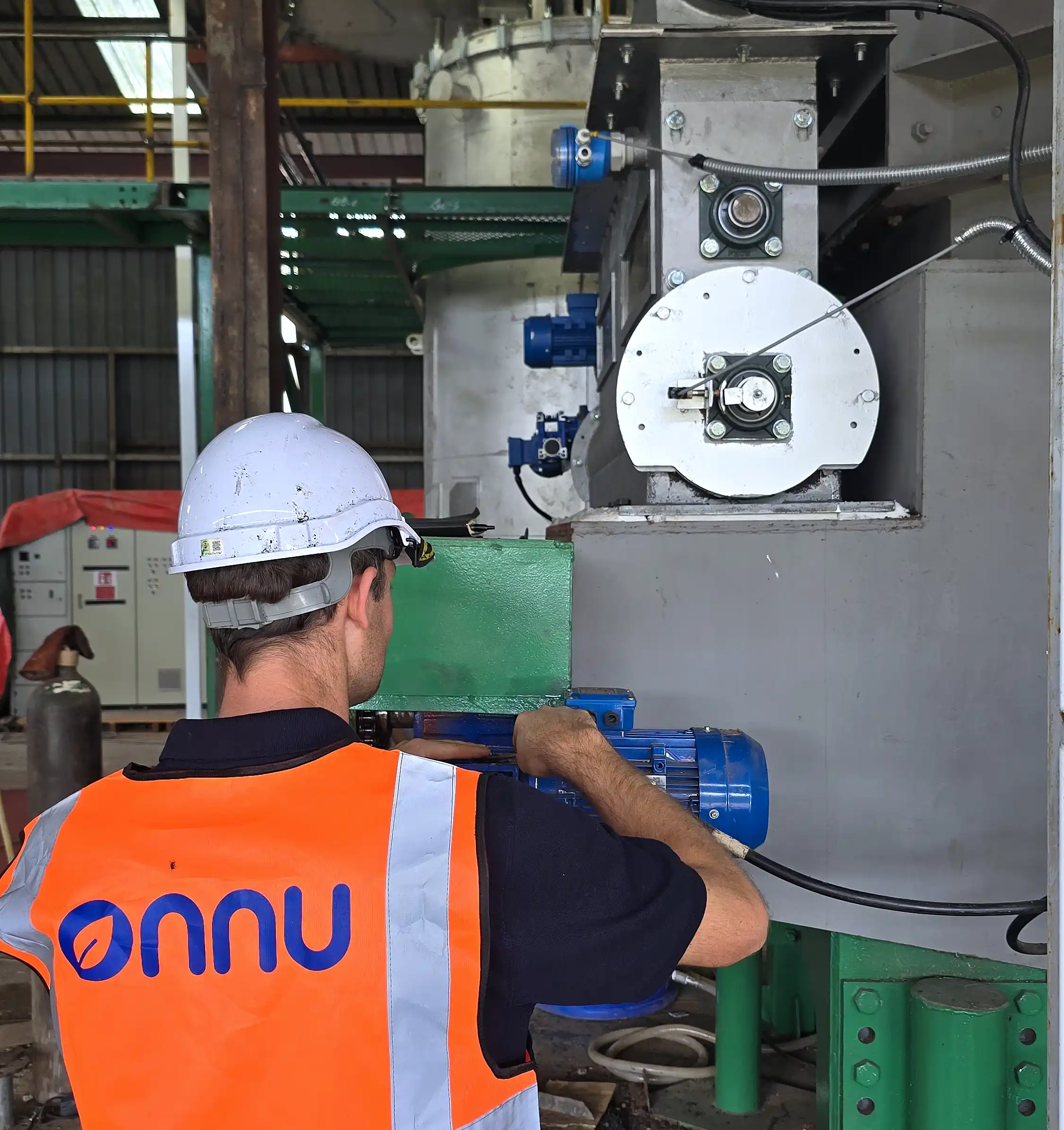 An engineer working on a carboflow pyrolysis machine.