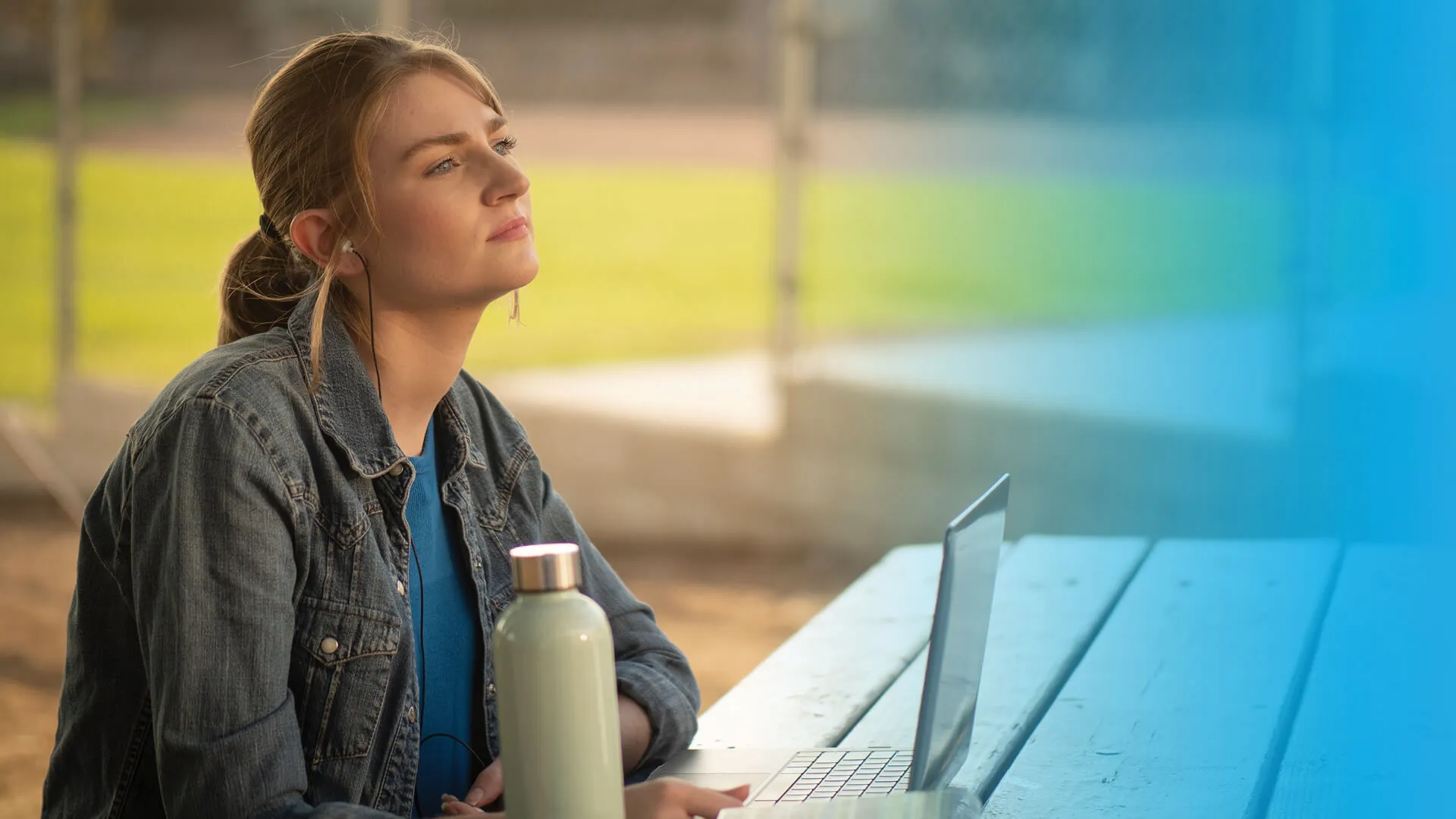 A young woman in the middle of studying on her laptop, looking concerned