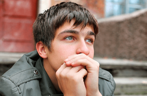 A teen looking pensive