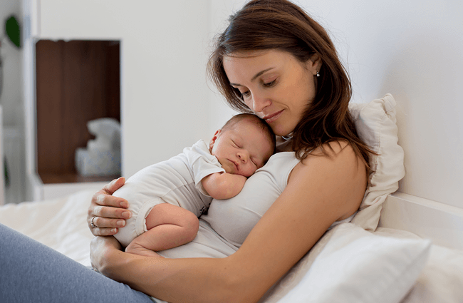 A mother holding her newborn baby