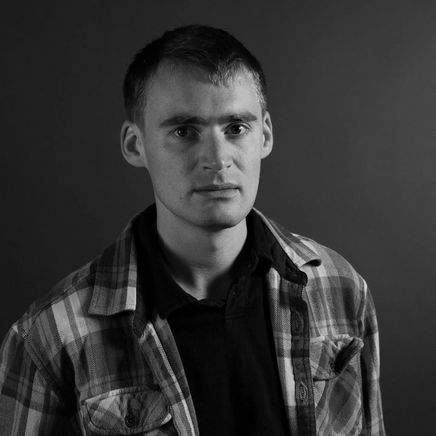 A young man, looking concerned