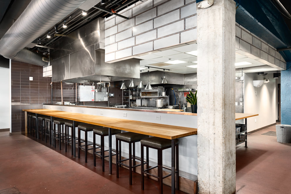 Chef instructor teaching students at Cook Street