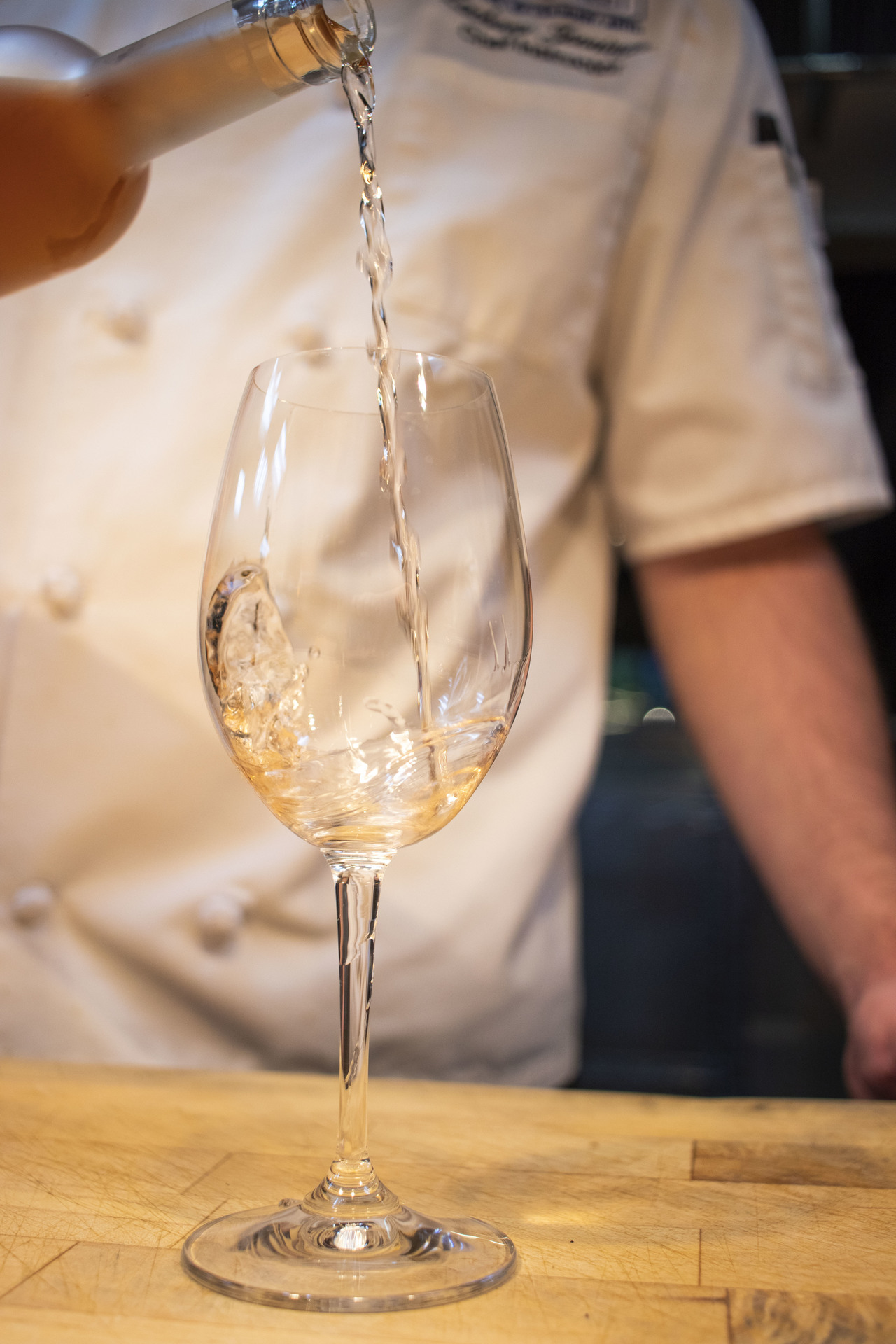 Pouring a glass of white wine
