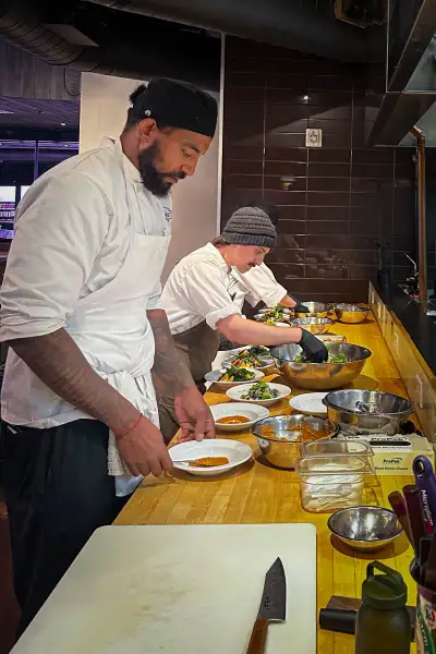 Cook Street chefs plating dishes in the kitchen