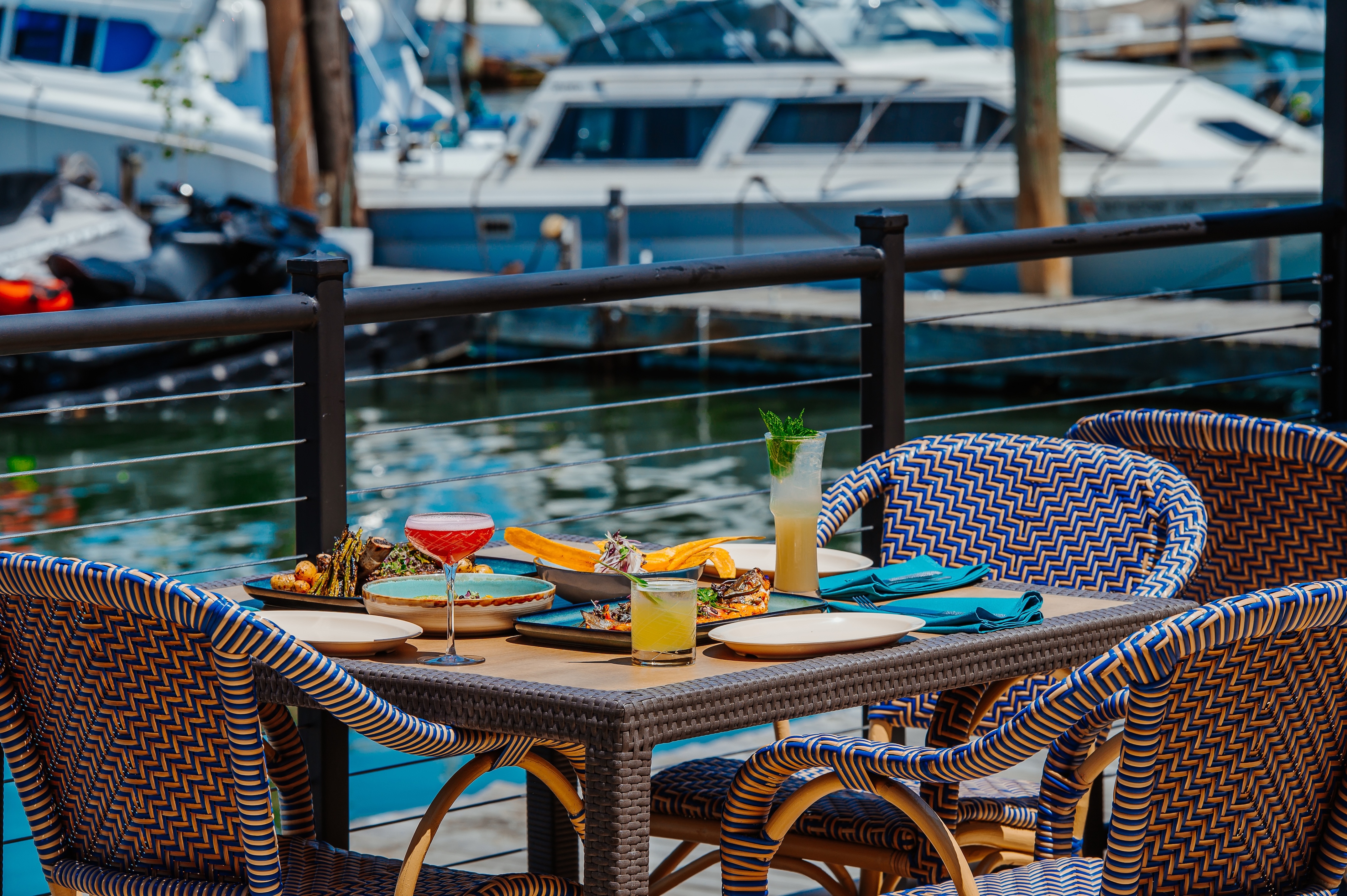 Table at waterfront with drinks stock image