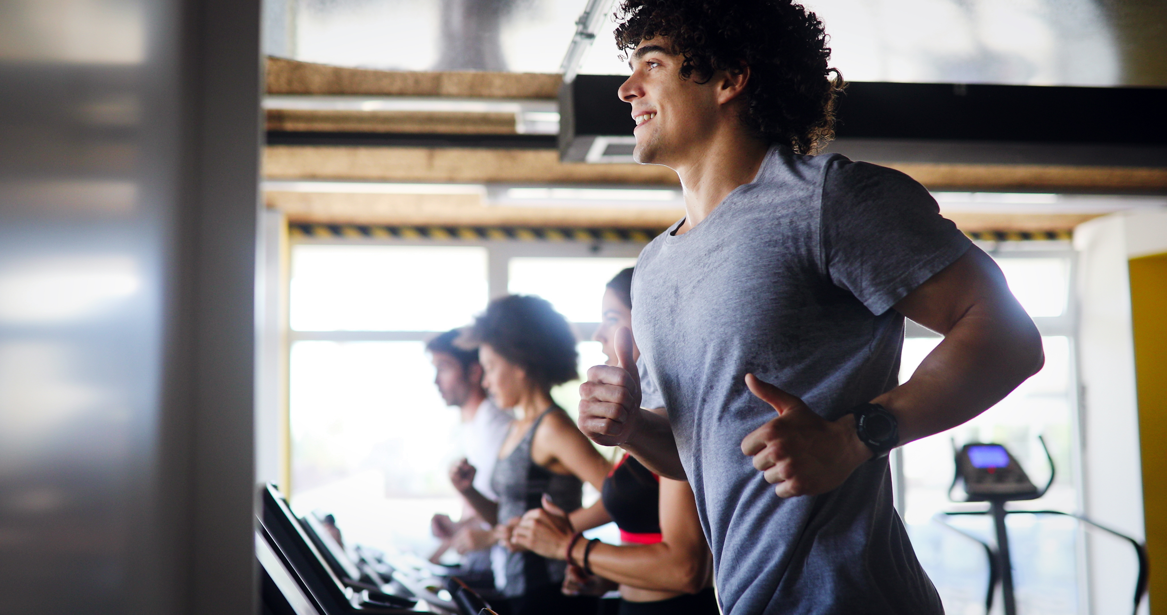 People running on treadmills stock image