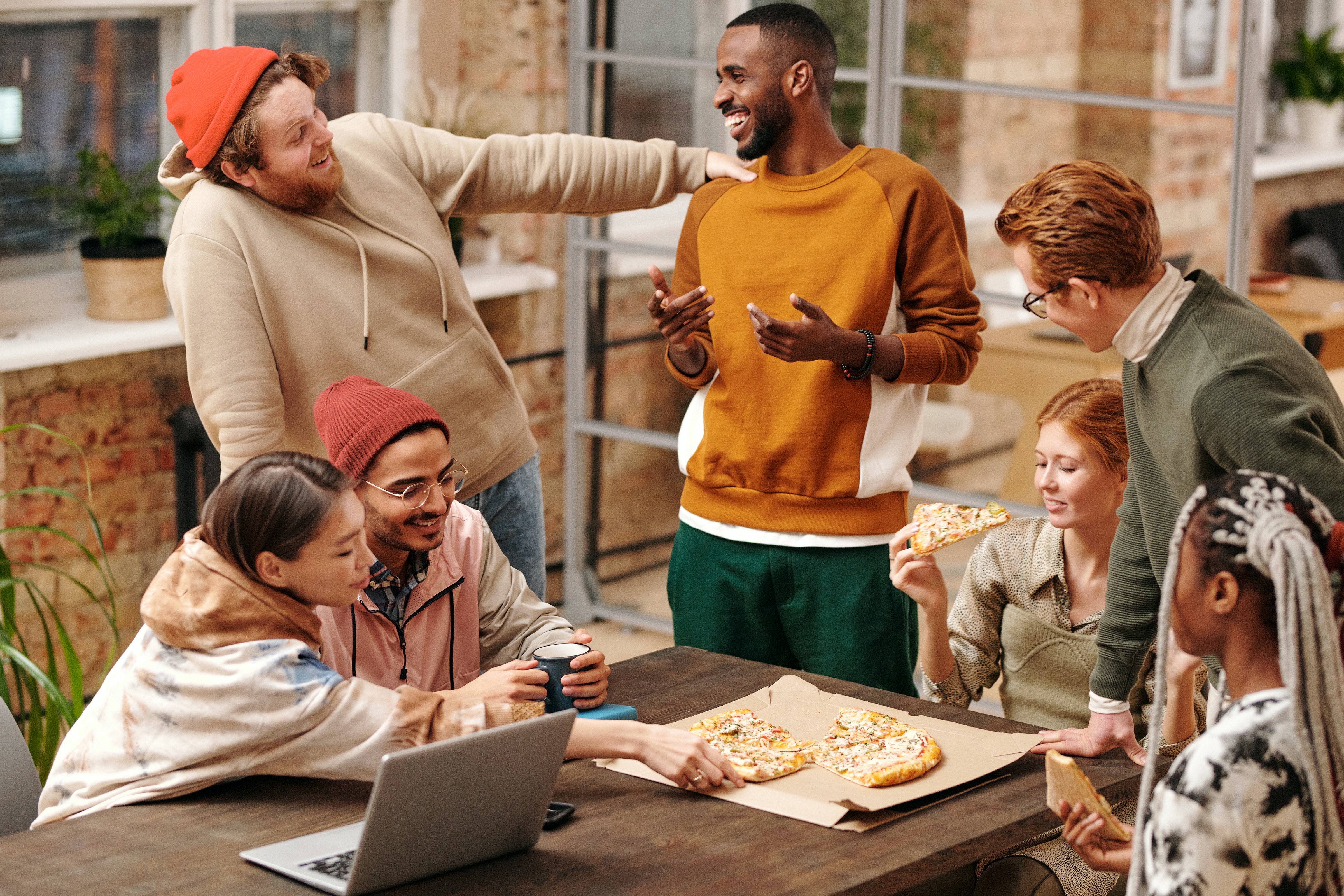 People laughing and eating food stock image