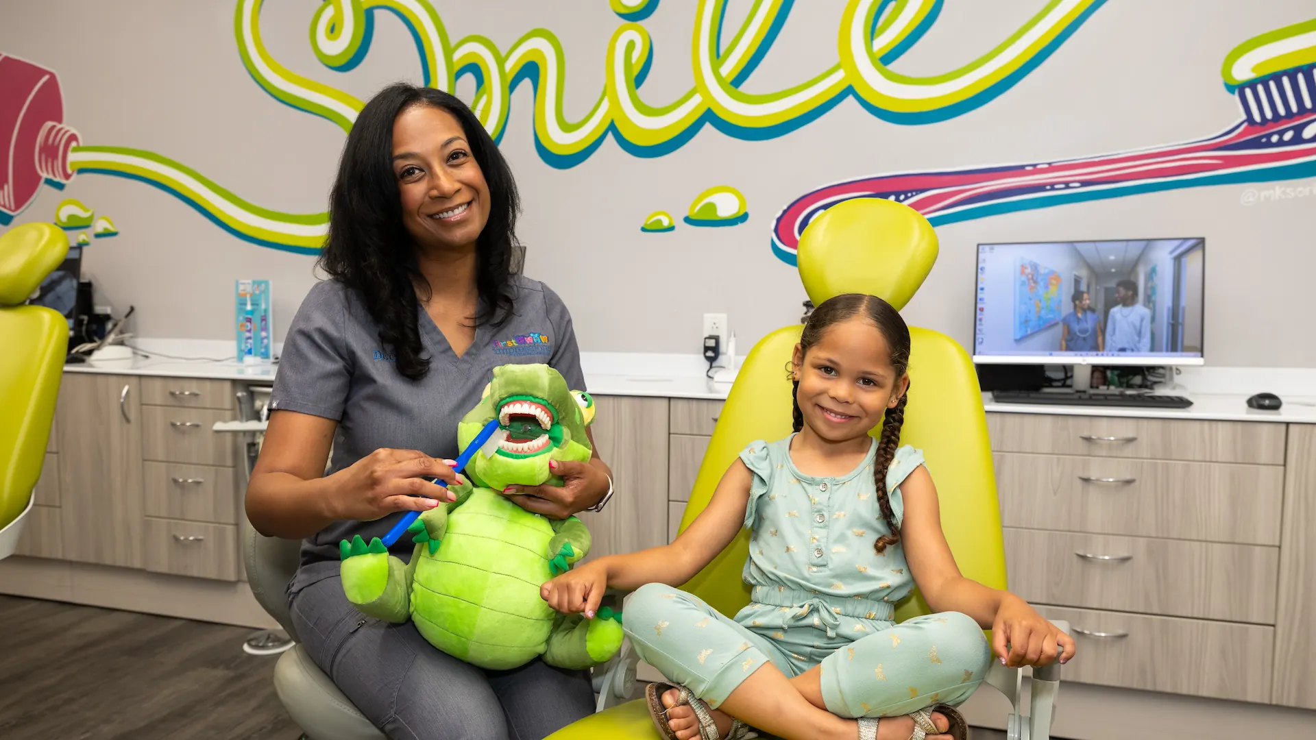 Dentist interacting with a child patient at First Impressions Pediatric Dentistry