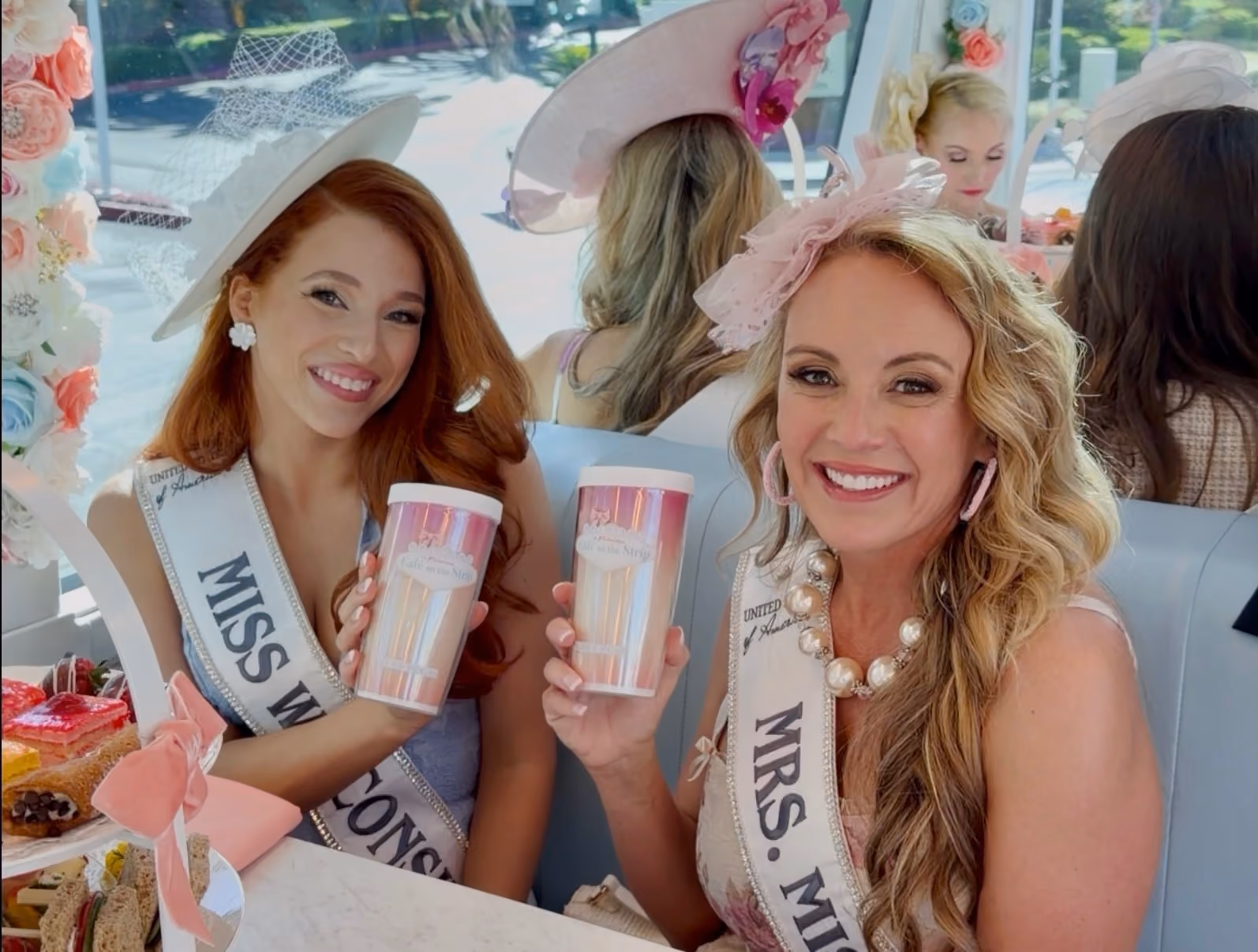 Guests enjoying high tea aboard the double-decker coach