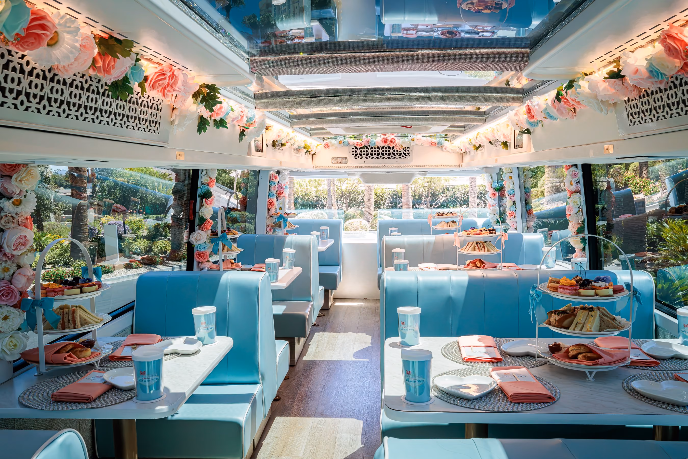 A three-tiered platter of tea sandwiches, scones, and sweets aboard the coach