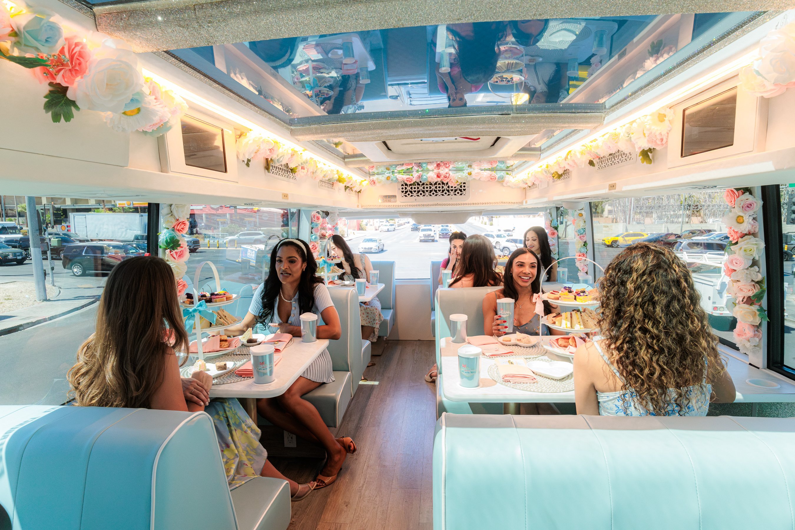 Host serving tea aboard the coach