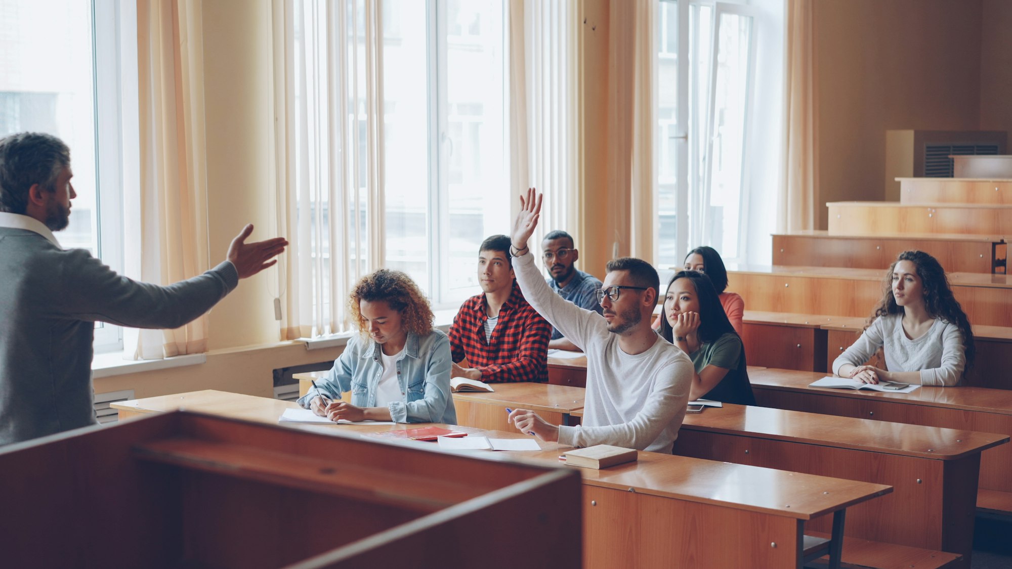 Teacher and students engaged in a classroom learning activity