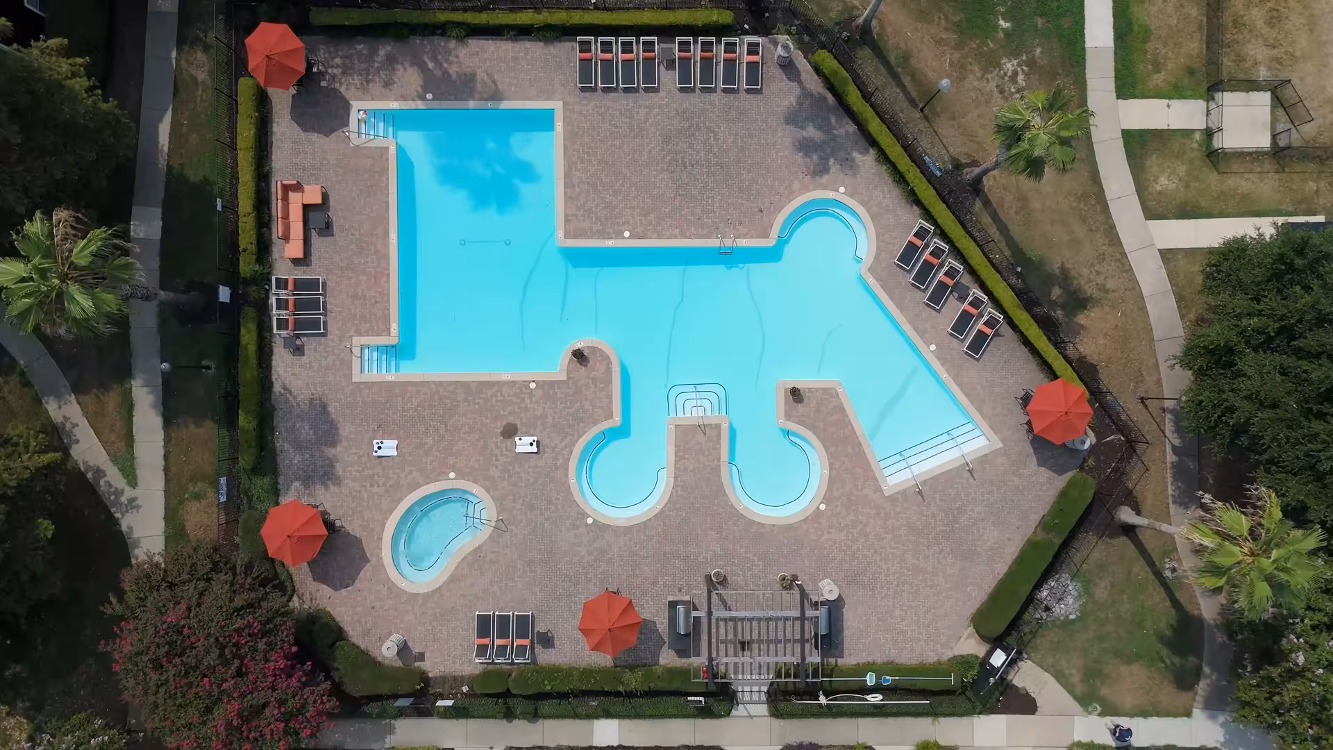 Aerial view of a resort-style pool at a B.HOM community