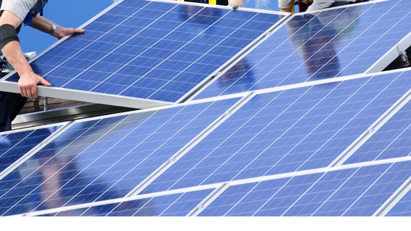 Solar installers installing solar panels on a house in Victoria