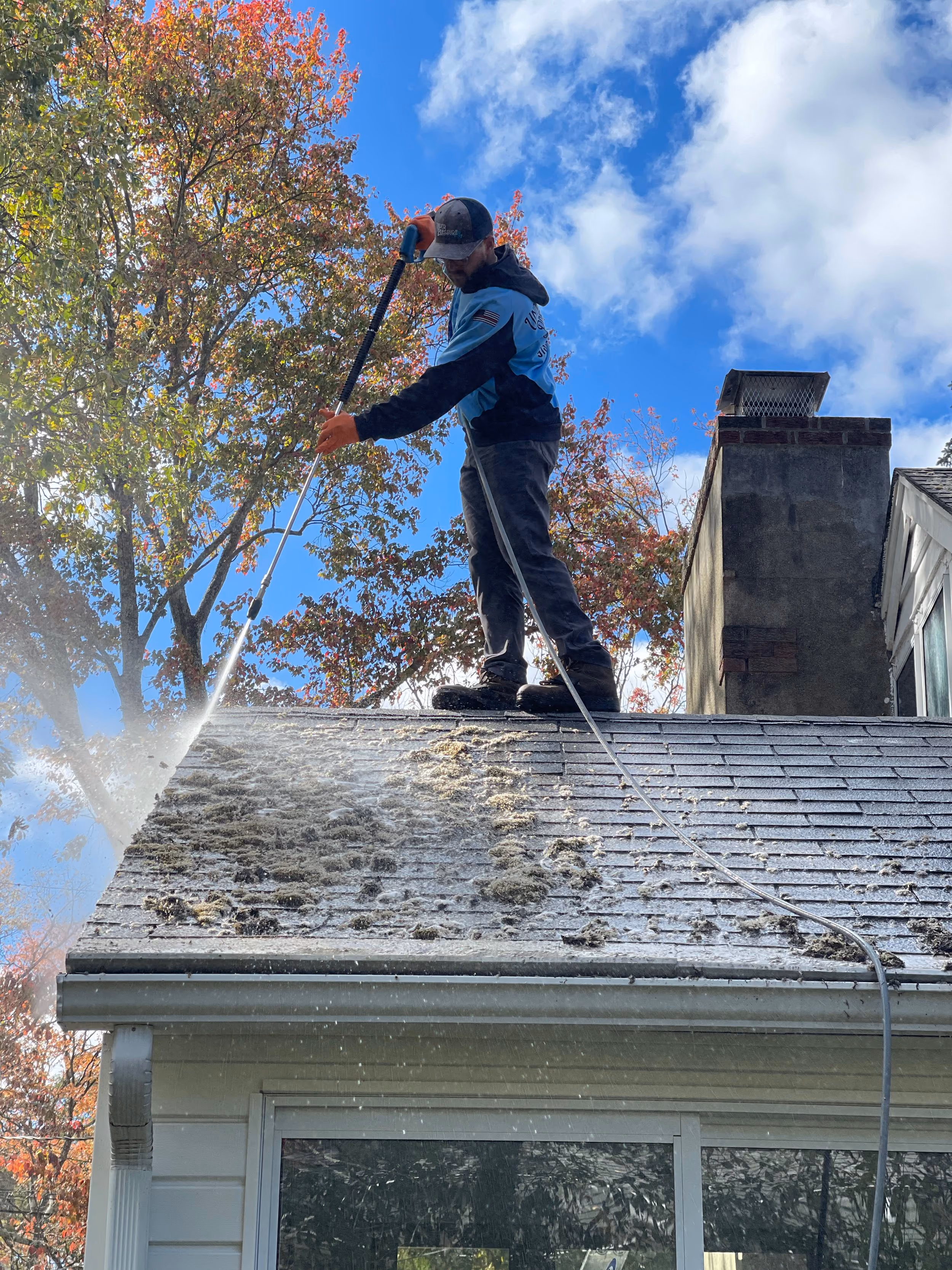 Soft washing a roof, aerial, NJ