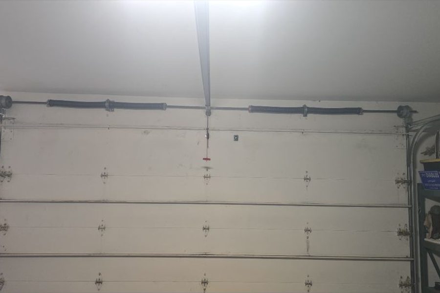 New torsion springs installed above a garage door — spring replacement in Corona, CA