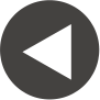 Circular black button with a white left-pointing triangle arrow inside