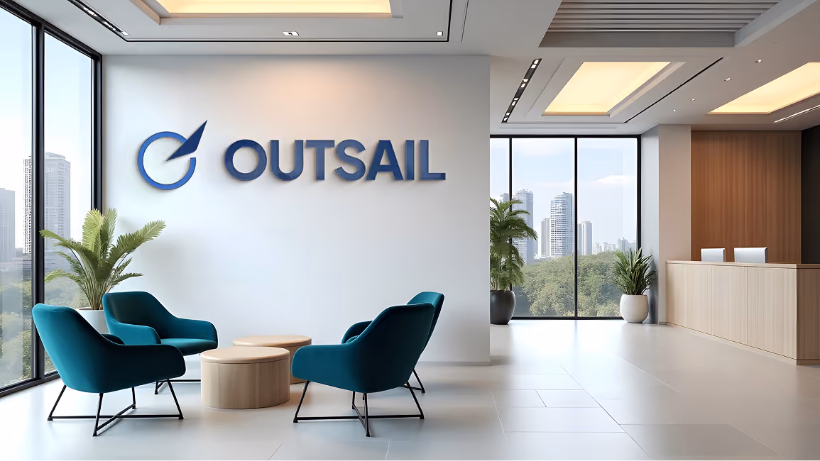 Modern conference room with gray chairs, a dark wood table, and Outsail logo on black wall.