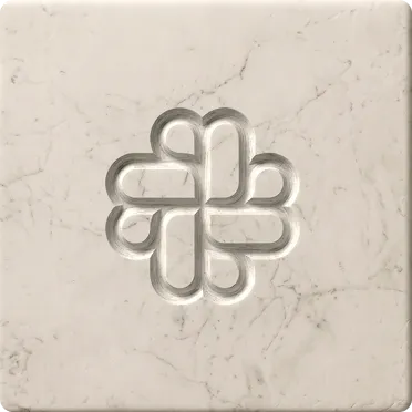Abstract embossed geometric pattern carved into a light marble square surface.