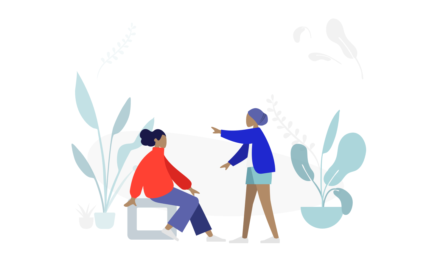 Two people in casual clothing stand beside a large white presentation screen with abstract plant illustrations around them.