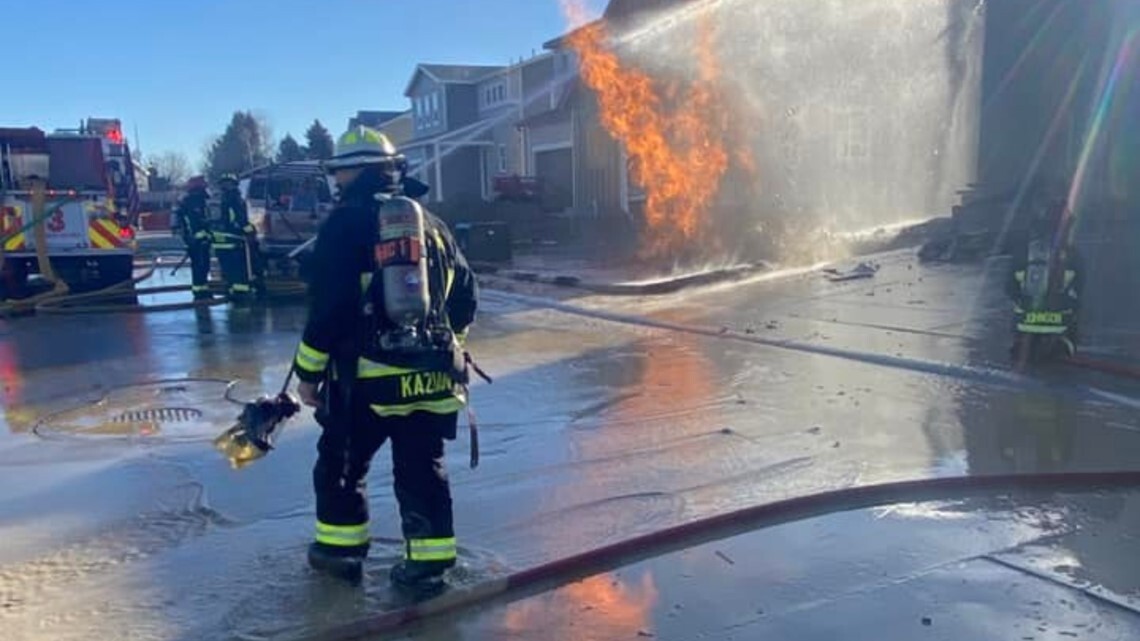 Windsor Severance firefighter putting out residential fire