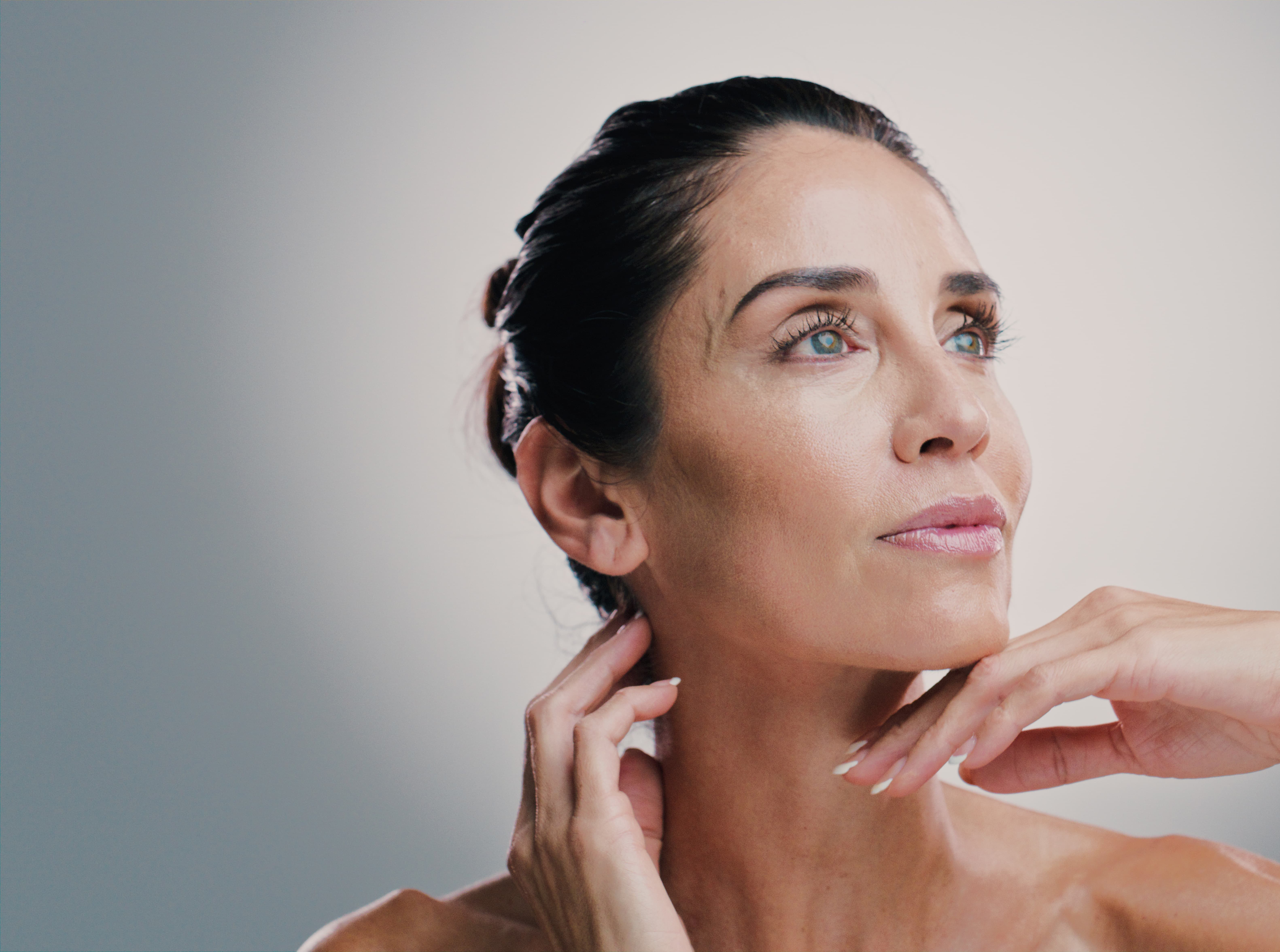 Patient receiving a Botox injection to the forehead from a physician