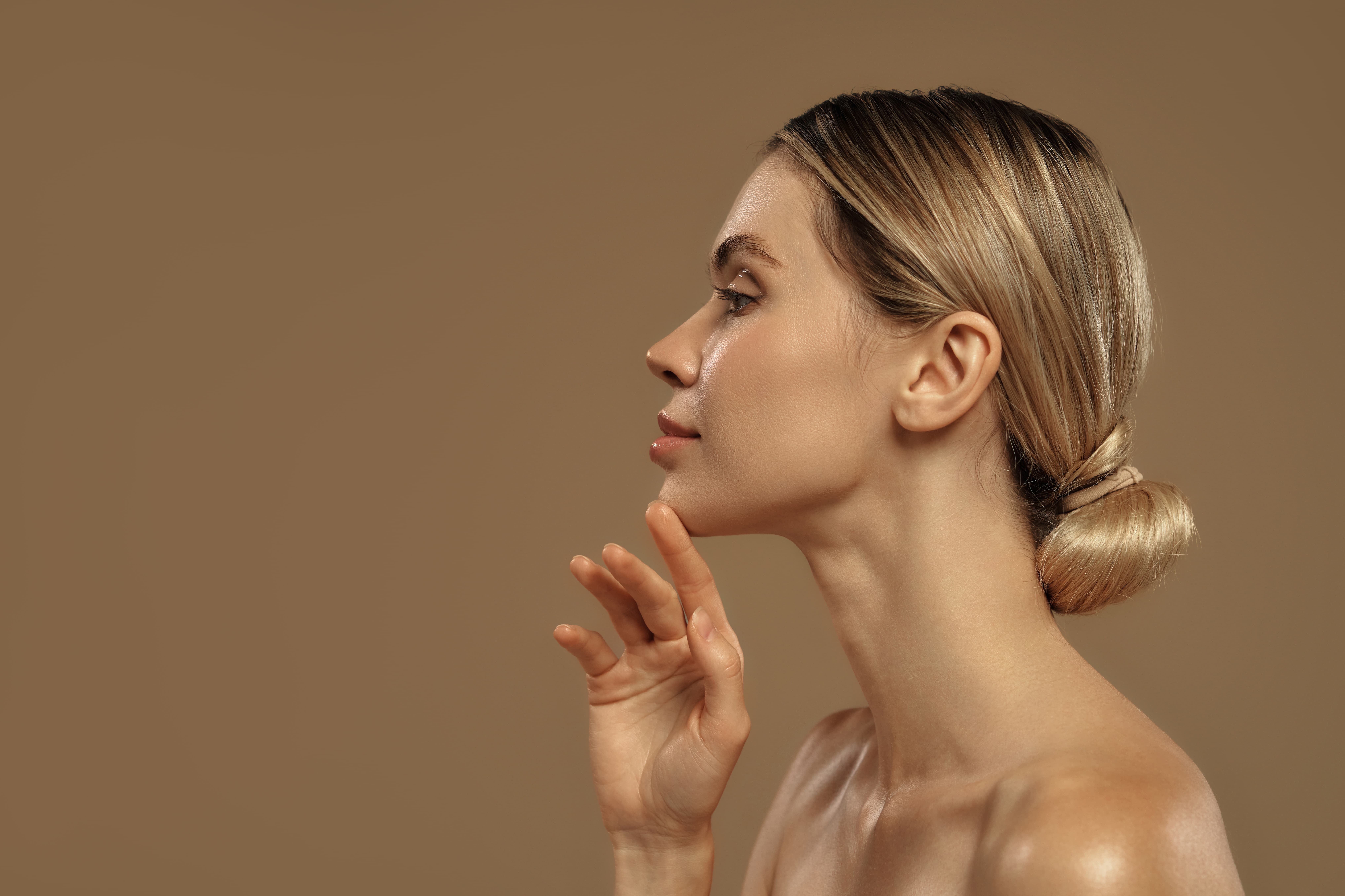 Patient receiving a dermal filler treatment to the midface