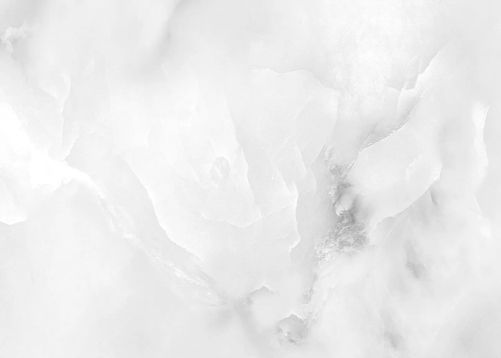 White marble surface with light gray veining and subtle texture patterns.