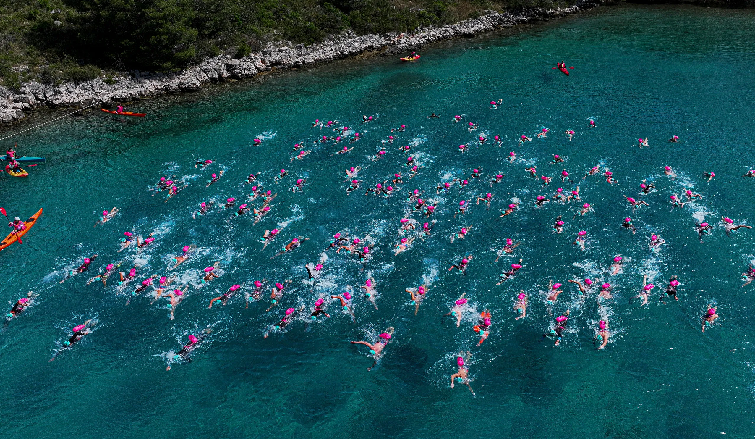 Swimmers in warm open water at an UltraSwim 33.3 event in Greece