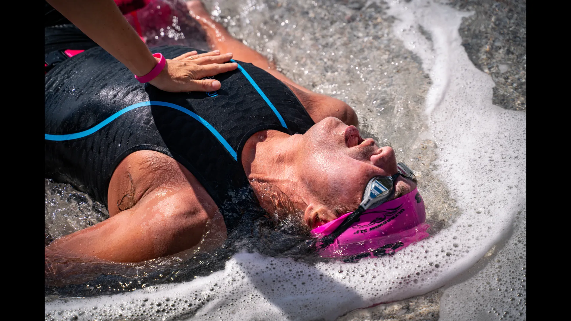 UltraSwim 33.3 #9 Greece, swimmer resting on the beach