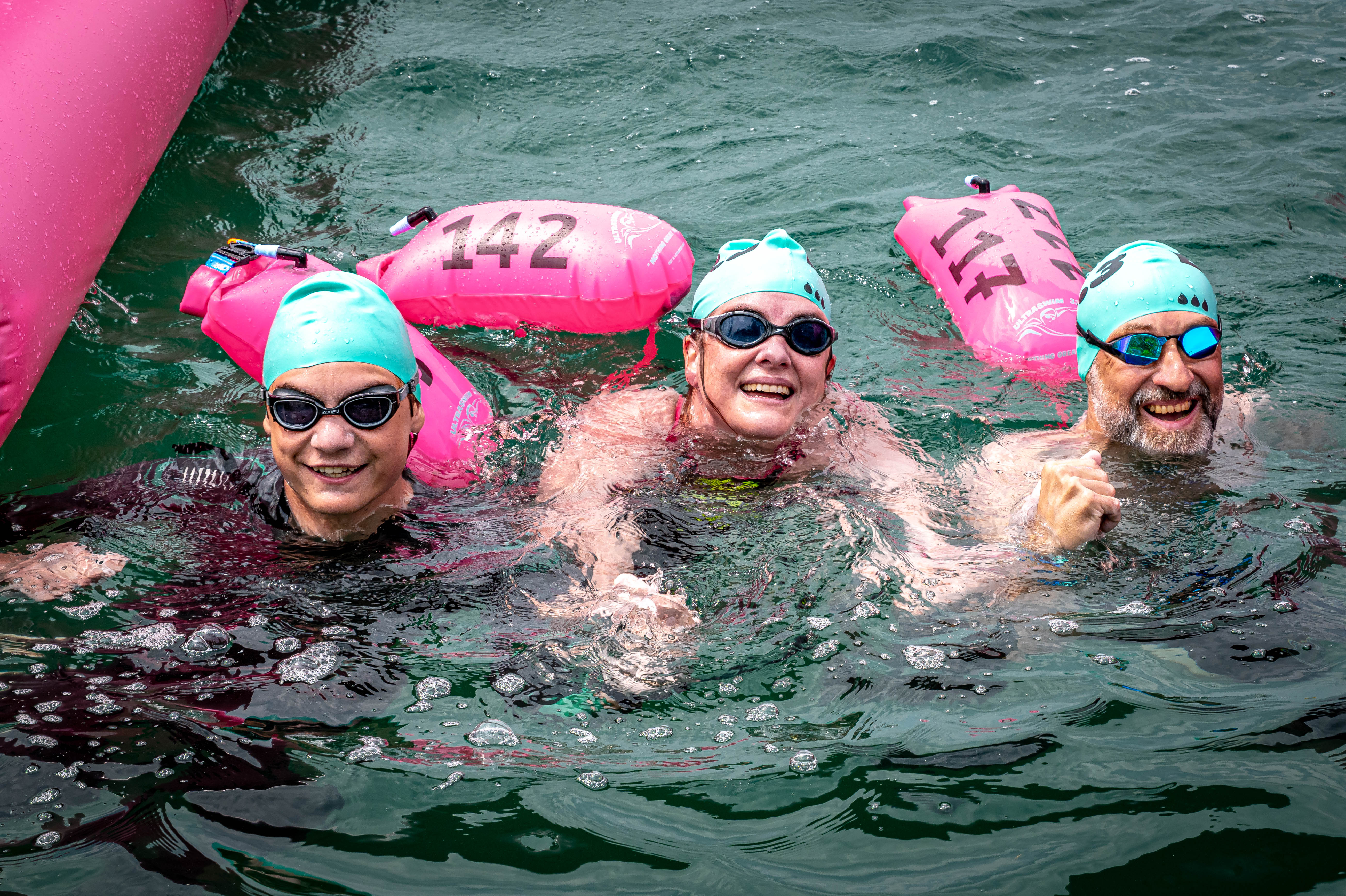 Swimmers in warm open water at an UltraSwim 33.3 event in Greece