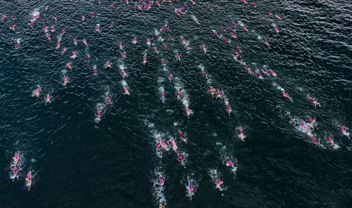 Swimmers in warm open water at an UltraSwim 33.3 event in Greece