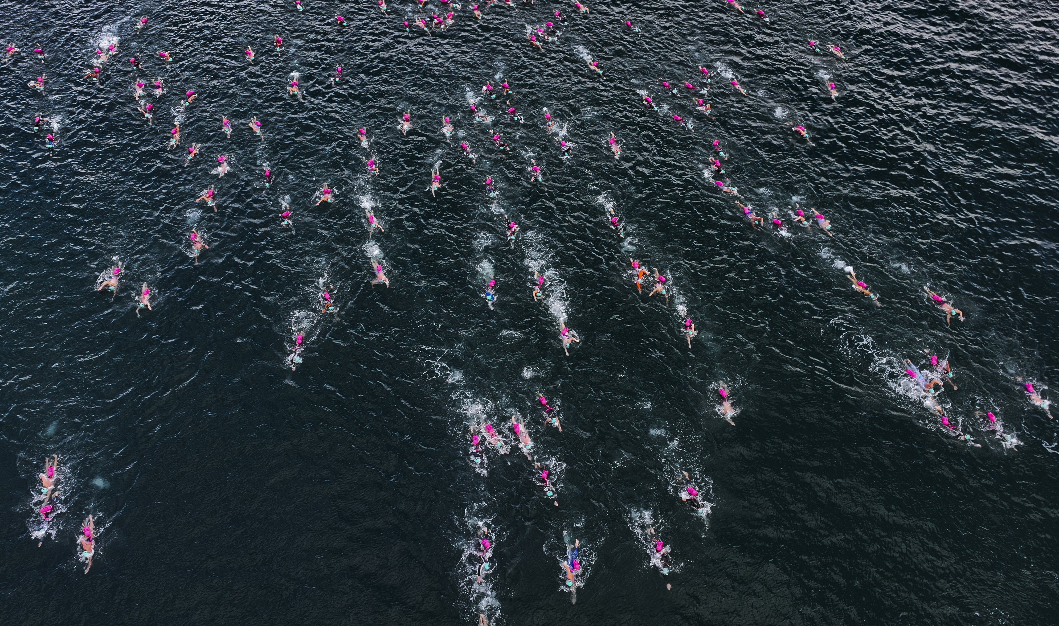 Swimmers in warm open water at an UltraSwim 33.3 event in Greece