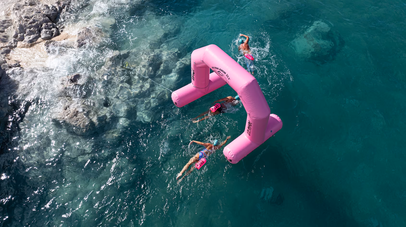Swimmers in warm open water at an UltraSwim 33.3 event in Greece