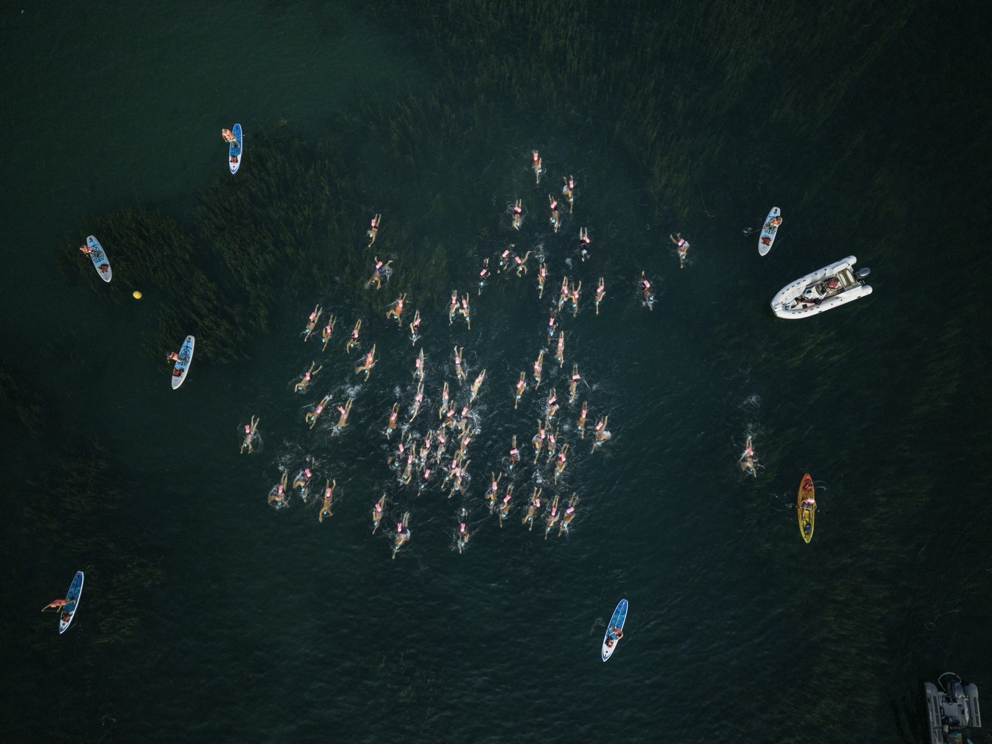 UltraSwim 33.3 #14 Switzerland, drone view of a swim pod with kayak and paddleboard