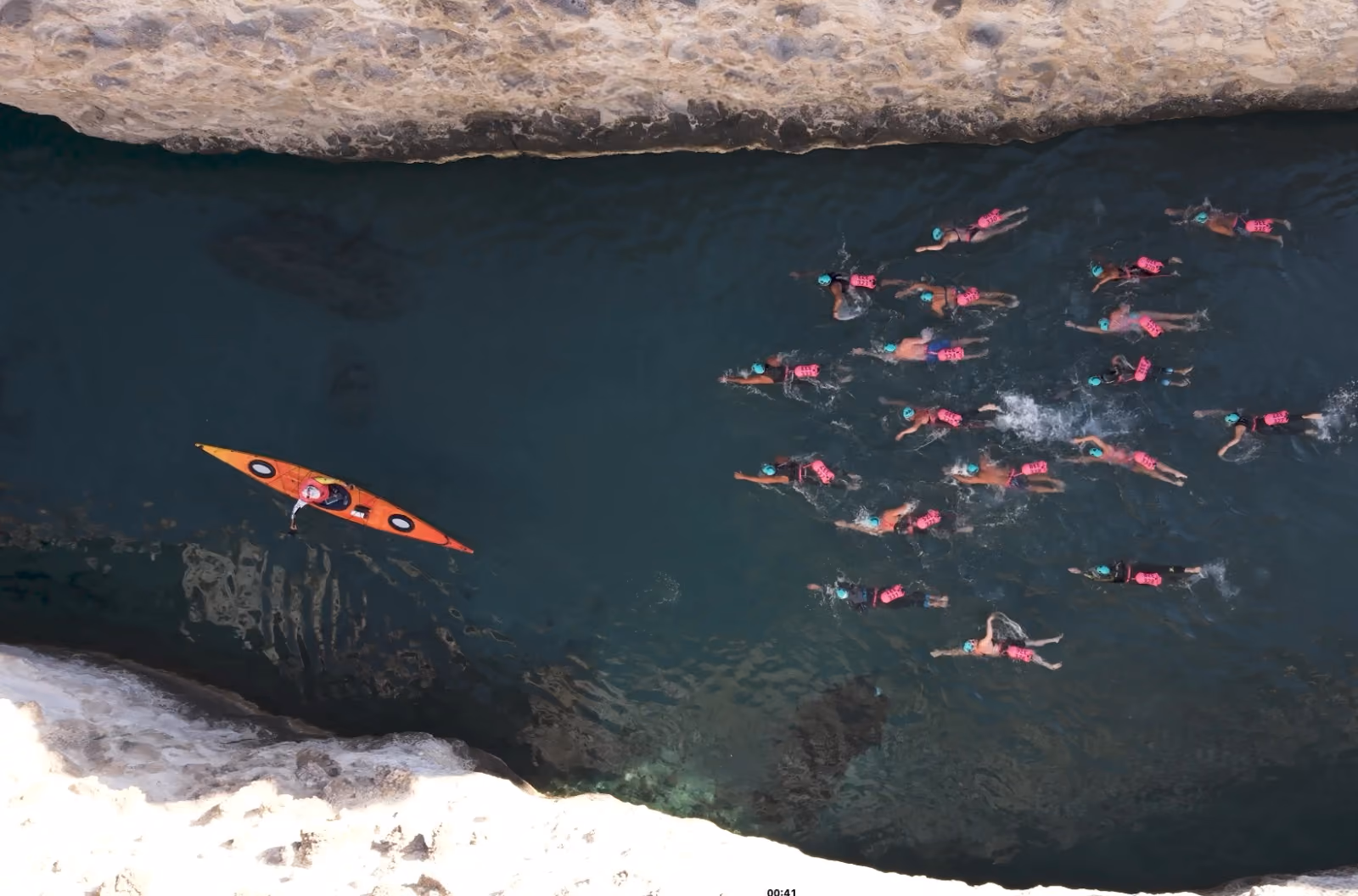 Drone view of a rock crack swim passage, Milos