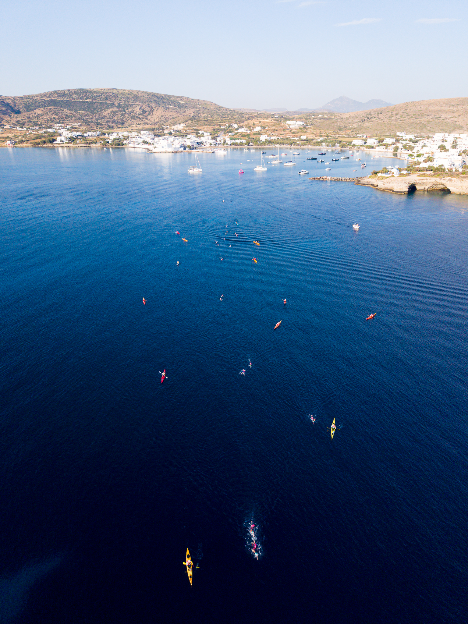 Swimmers in warm open water at an UltraSwim 33.3 event in Greece