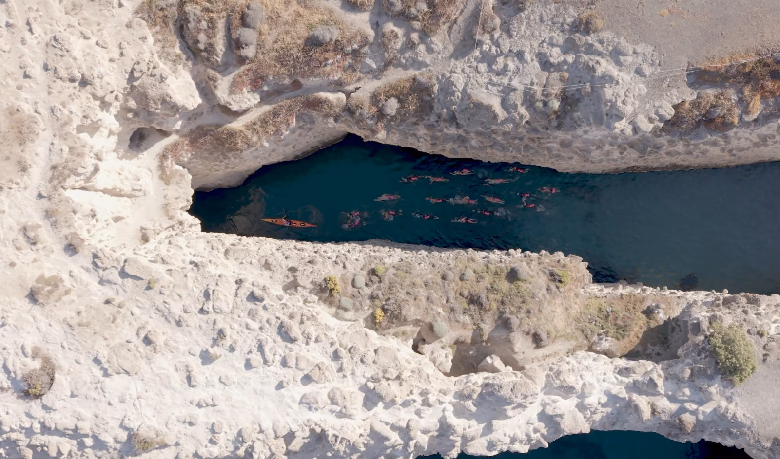 Swimmers in warm open water at an UltraSwim 33.3 event in Greece