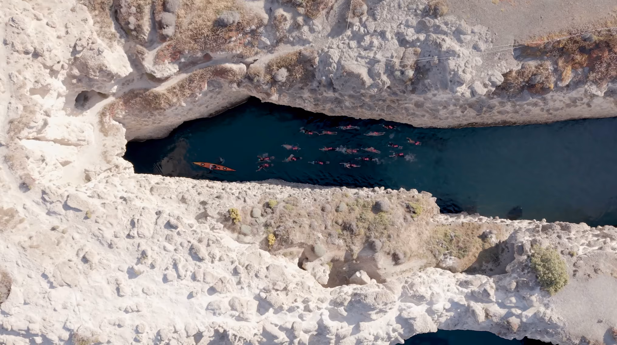 Drone view of volcanic rock crack, Milos