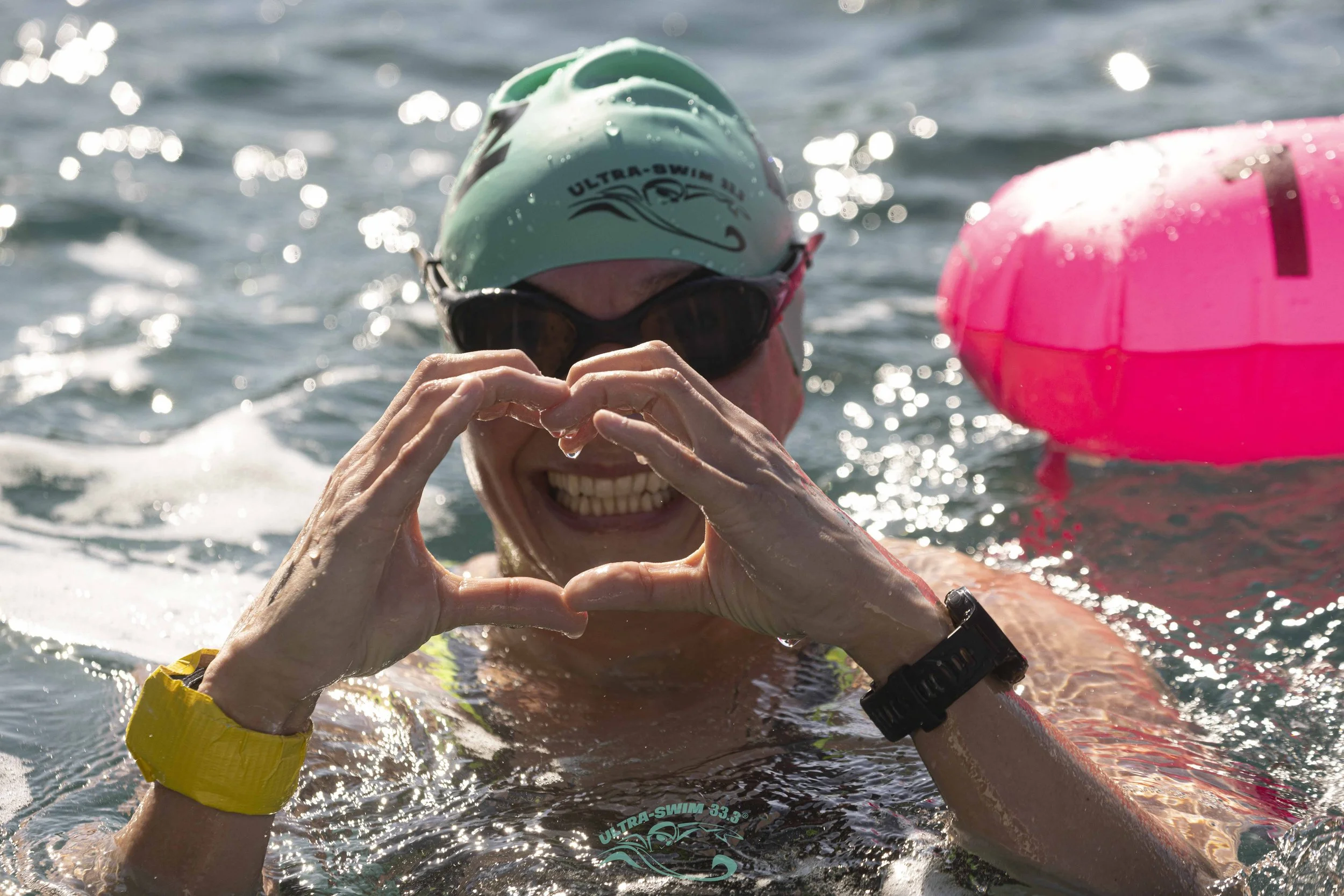 UltraSwim 33.3 swimmer making a heart shape at the finish