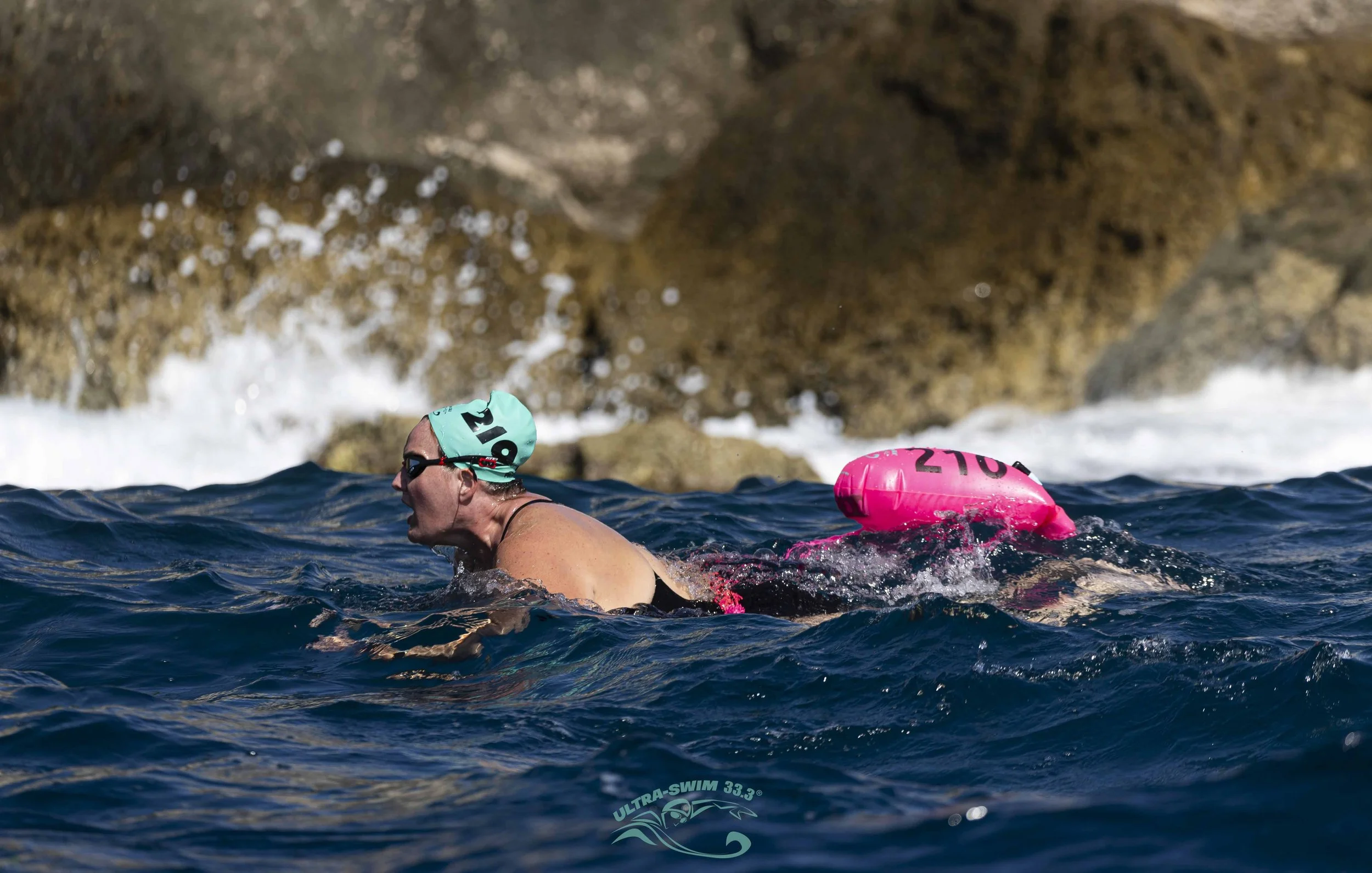 Swimmers in warm open water at an UltraSwim 33.3 event in Greece