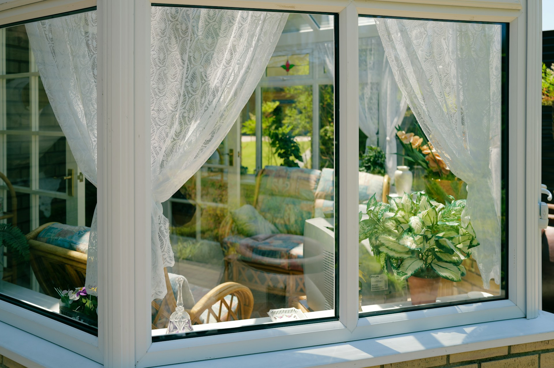 Stock photo, uPVC double glazed windows looking into a conservatory with plants