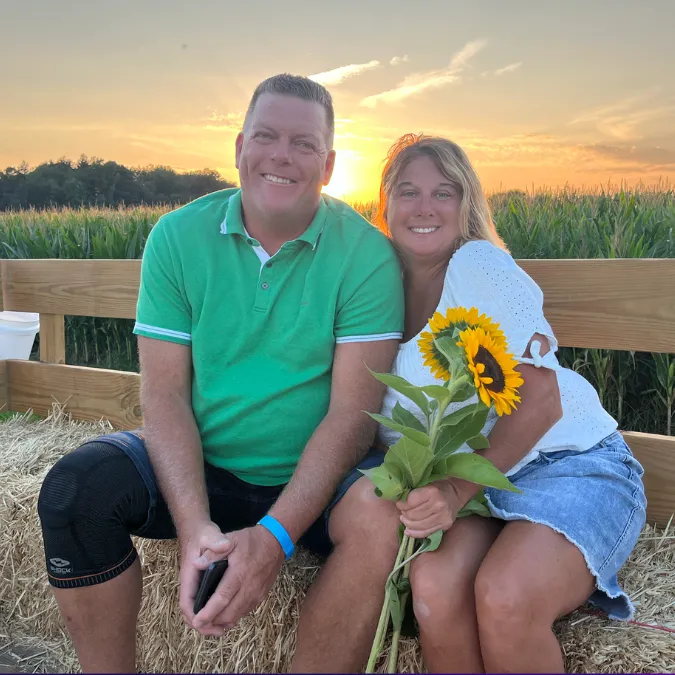 red-barn-farm-sunflower-couple-hayride