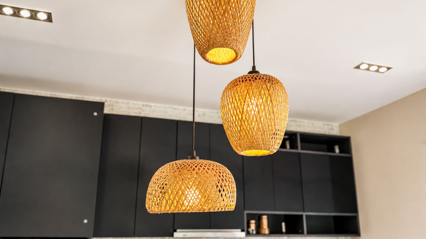 Woven pendant lights over a kitchen